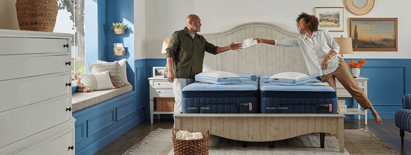 A couple making their Lux Hybrid bed