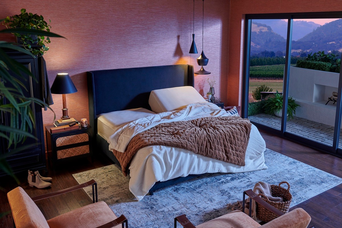 A luxurious bedroom with stylish lighting and decor elements
